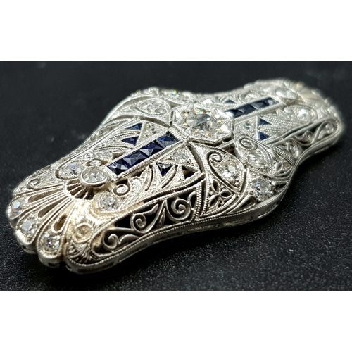 47 - A beautiful Art deco 18 K white gold brooch with Diamonds and blue sapphires. Dimensions: 44 x 21 x ... 