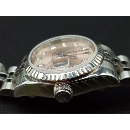 82 - A ladies ROLEX Oyster Perpetual Datejust, stainless steel watch. 26 mm dial, pink face with diamond ... 