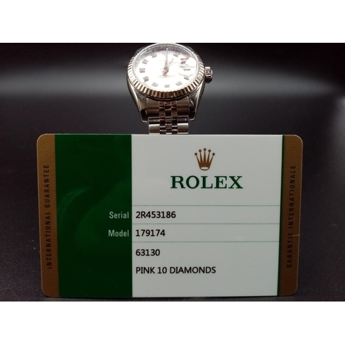 82 - A ladies ROLEX Oyster Perpetual Datejust, stainless steel watch. 26 mm dial, pink face with diamond ... 