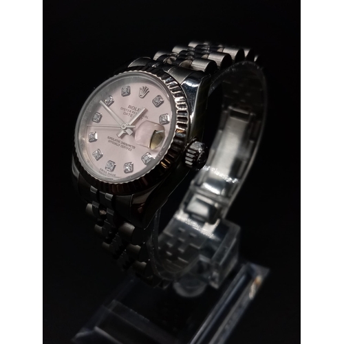 82 - A ladies ROLEX Oyster Perpetual Datejust, stainless steel watch. 26 mm dial, pink face with diamond ... 