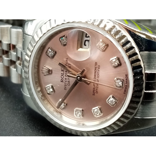 82 - A ladies ROLEX Oyster Perpetual Datejust, stainless steel watch. 26 mm dial, pink face with diamond ... 