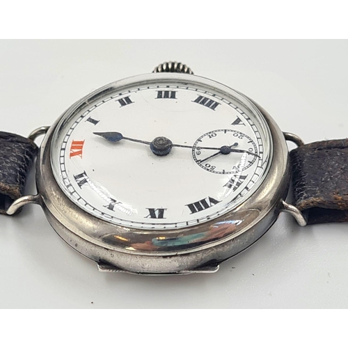 344 - Antique First World War Officers Silver Trench Watch in good working order on original strap