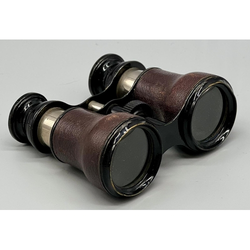 391 - A PAIR OF LEATHER BOUND STATIC OPERA GLASSES WITH FOCUS ADJUSTMENT ,A/F