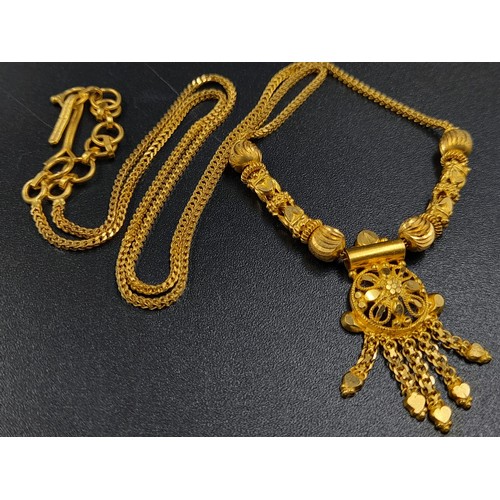 59 - An interesting lot of high carat yellow gold group of items (possibly Indian). Total weight: 117 g.