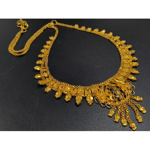 59 - An interesting lot of high carat yellow gold group of items (possibly Indian). Total weight: 117 g.