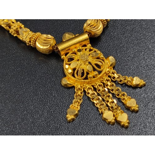 59 - An interesting lot of high carat yellow gold group of items (possibly Indian). Total weight: 117 g.