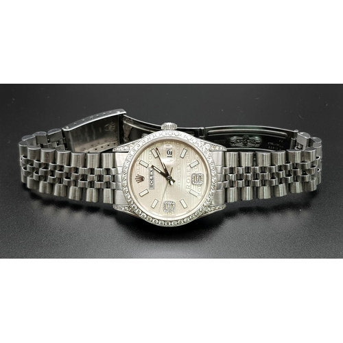 29 - A gents ROLEX Datejust stainless steel watch. 36 mm dial with diamond bezel and champagne coloured f... 