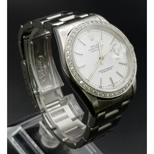 75 - A gents, ROLEX Oyster Perpetual Datejust, watch. Stainless steel, 36 mm dial with diamond studded be... 