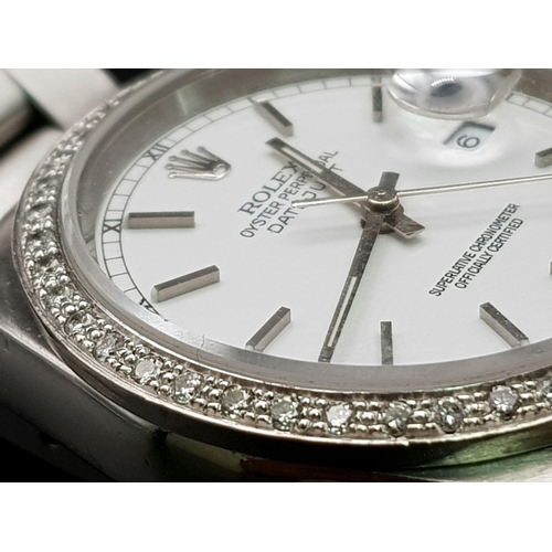 75 - A gents, ROLEX Oyster Perpetual Datejust, watch. Stainless steel, 36 mm dial with diamond studded be... 