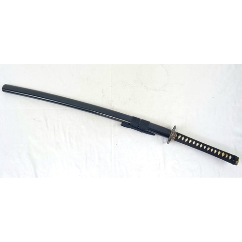 387 - A Reproduction Hand-Forged Tetsuyama Katana. Comes with a scabbard. Blade length - 74cm.