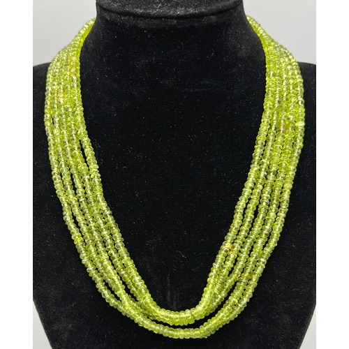 311 - A 5 rows of 440cts Peridot Gemstone Choker, 16 inches long with a Garnet Clasp set in 925 Silver