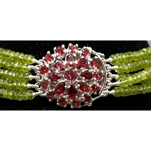 311 - A 5 rows of 440cts Peridot Gemstone Choker, 16 inches long with a Garnet Clasp set in 925 Silver