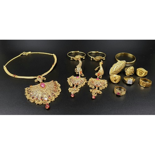 34 - A MIXED LOT OF GOLD JEWELLERY TO INCLUDE:
6 X 22K GOLD RINGS   48.5gms
A 22K GOLD BABY KADA   12.7gm... 