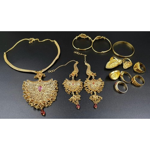 34 - A MIXED LOT OF GOLD JEWELLERY TO INCLUDE:
6 X 22K GOLD RINGS   48.5gms
A 22K GOLD BABY KADA   12.7gm... 