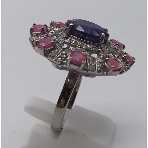 339 - A very impressive 8cts Blue Sapphire centre stone Ring with 2cts Ruby Accents and 1.10cts Diamonds i... 