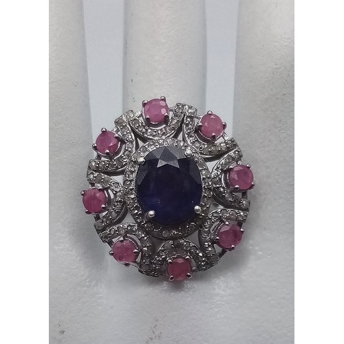 339 - A very impressive 8cts Blue Sapphire centre stone Ring with 2cts Ruby Accents and 1.10cts Diamonds i... 