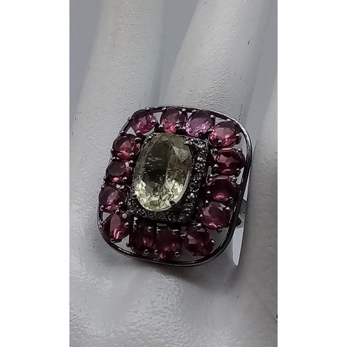 318 - 3.80cts Citrine centre stone set Ring with 5.50cts Rhodochrosite and 0.35cts Diamonds decorating in ... 