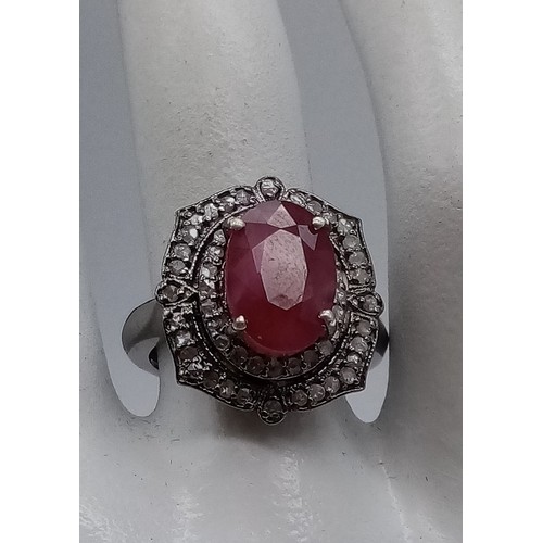 426 - 5.80cts Ruby Centre stone set Ring with 0.60cts Diamonds surrounding, Antique Style size N