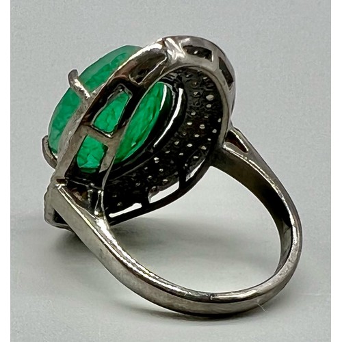 332 - 8.15cts Emerald Gemstone Ring in 925 Silver with a halo of two rows of diamonds ,1.20cts Diamonds in... 