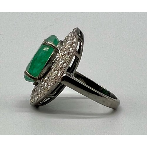 332 - 8.15cts Emerald Gemstone Ring in 925 Silver with a halo of two rows of diamonds ,1.20cts Diamonds in... 