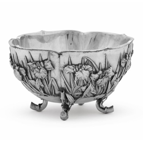 514 - A large stunning solid silver Japanese bowl
C1900,

Lobed oval form, chased and embossed with water ... 