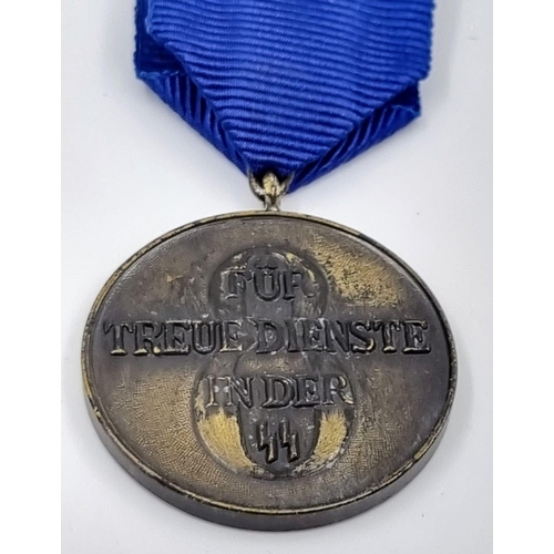 302 - Museum Quality Replica Waffen SS Long Service Medal. A very good convincing copy that worn look good... 