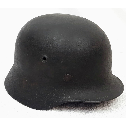 187 - WW2 German M40 Helmet. With liner and fragile chinstrap. Remains of a single decal can be seen.