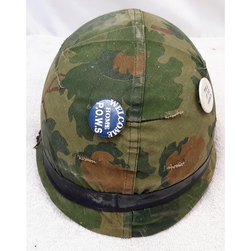 316 - Vietnam War Era US M1 Helmet and liner. Complete with a reversible Mitchel/Duck Hunter cover.