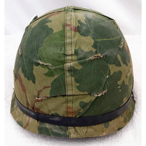 316 - Vietnam War Era US M1 Helmet and liner. Complete with a reversible Mitchel/Duck Hunter cover.