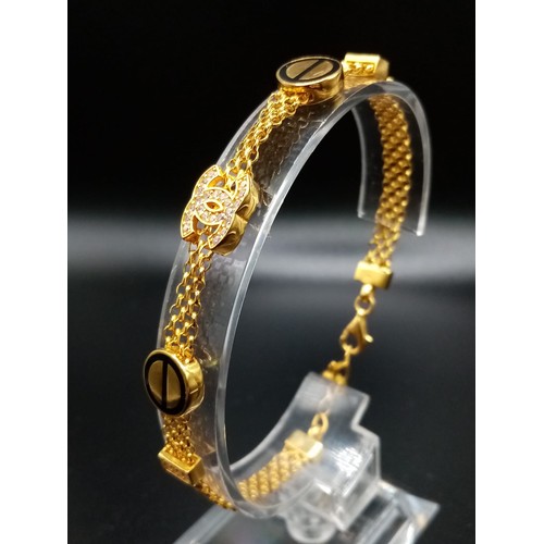 90 - A 21K Yellow Gold Bracelet with White Stone and enamel Decoration - Plus an 18K Yellow Gold Disappea... 