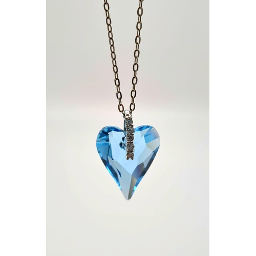 934 - A Silver Chain with Blue Heart Pendant. 2.5 and 44cm