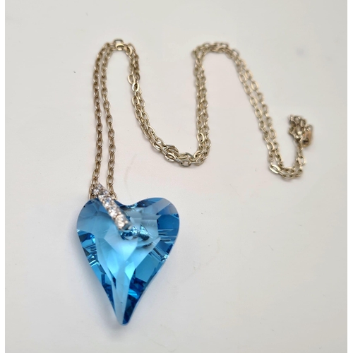 934 - A Silver Chain with Blue Heart Pendant. 2.5 and 44cm