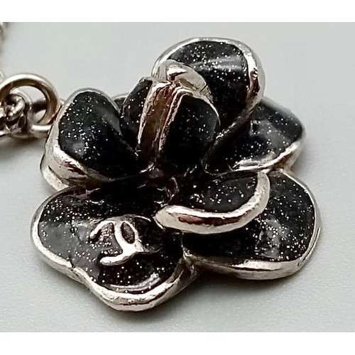 910 - Silver metal chain with pretty 3D black flower pendant. Chain length 42cm, pendant size 23mm