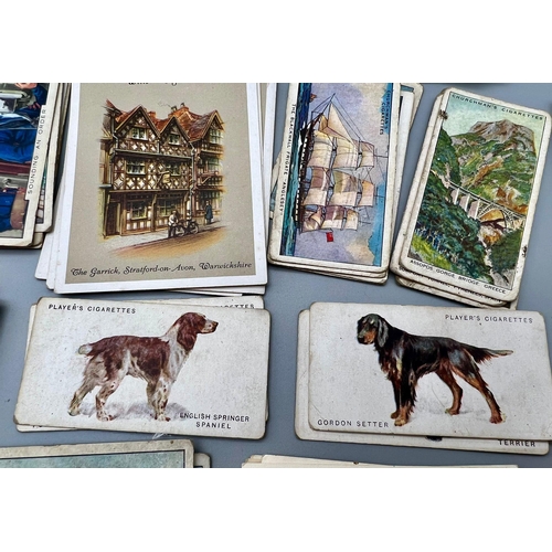 974 - A Collection of Over 100 Vintage and Antique Cigarette 
Cards.