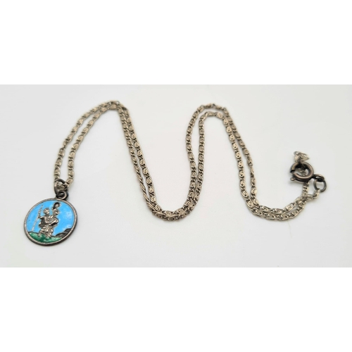 889 - A Silver Necklace with Enamel St. Christopher Pendant.
1 and 44cm. Plus a silver ingot pendant - 4.5... 