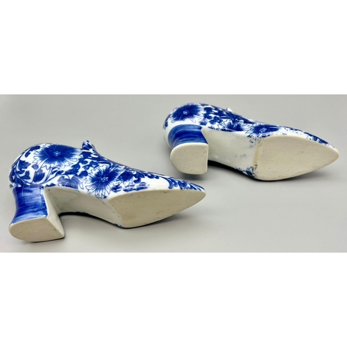 896 - A Pair of Vintage Blue and White Porcelain Shoes. 18 x 10cm. In good condition but A/F.