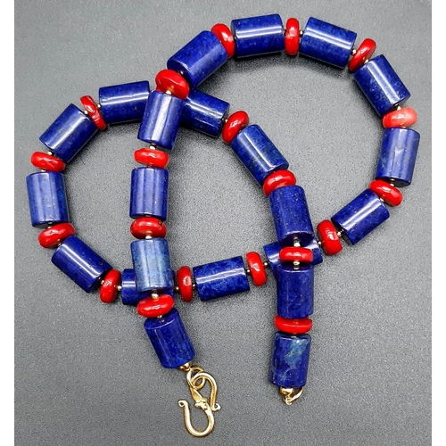 113 - A substantial lapis lazuli and red coral necklace and earrings set in a presentation box. Necklace l... 