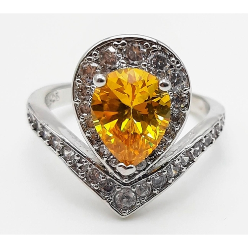 176 - A white metal ring and earrings set with yellow topaz and white sapphires. Ring size: N, presented i... 