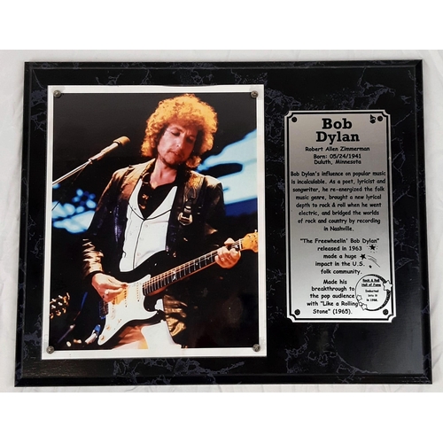 477 - A Bob Dylan Playing Guitar Picture (circa 1980s) and an Informative Plaque. On wood base - 39 x 31cm... 