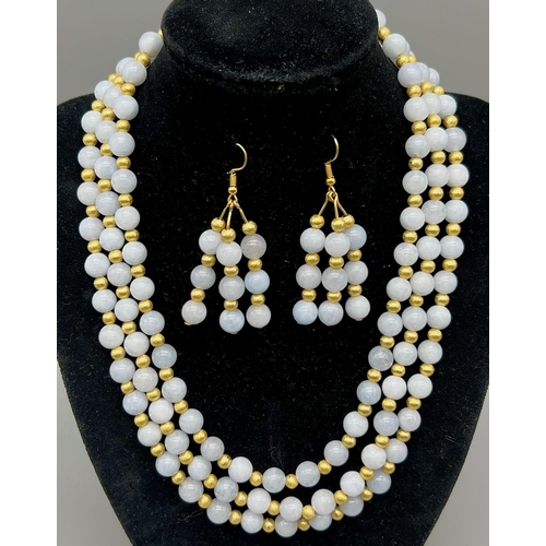 169 - A three strand aquamarine necklace and earrings set. Necklace length: 43-49 cm, earrings length: 6 c... 