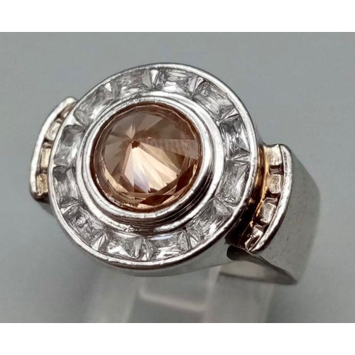 232 - A modern, white metal, (untested) ring with morganites and white sapphires, presented in a gorgeous,... 