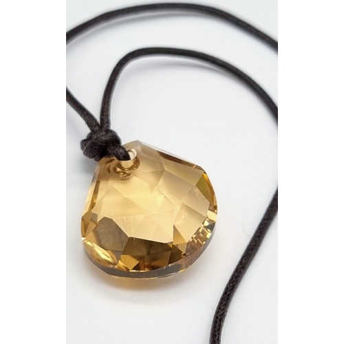 512 - A Swarovski Amber Glass Crystal Pendant on a Thin Rope Necklace. As new, in original box with certif... 