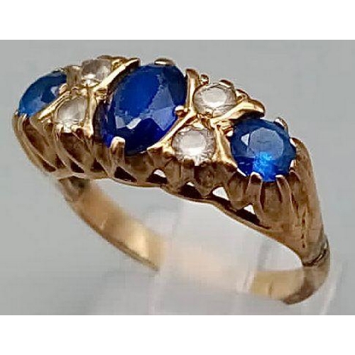 97 - A 9K Yellow Gold Blue and White Stone Ring. Size O.
4.1g total weight.