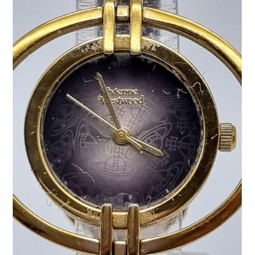 498 - A Vivienne Westwood Ladies Quartz Dress Watch. Leather strap. Gilded orbiting case - 35mm. In workin... 