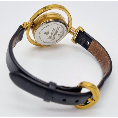 498 - A Vivienne Westwood Ladies Quartz Dress Watch. Leather strap. Gilded orbiting case - 35mm. In workin... 