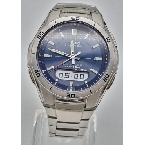 26 - A Casio Wave Ceptor Quartz Gents Watch. Stainless steel strap and case - 42mm. Blue dial with multi-... 