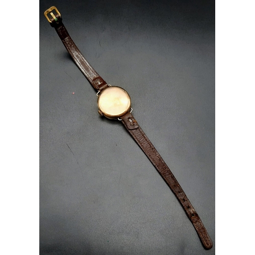 3 - A Vintage Omega 9K Gold Cased Ladies Watch. Leather strap. Gold case - 26mm. Mechanical movement but... 