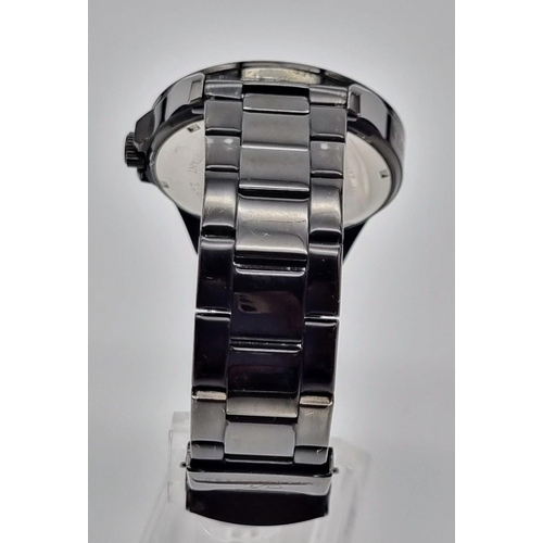 366 - A Klaus Kobec Quartz Gents Watch. Black steel strap and case - 45mm. Black dial with date window. In... 