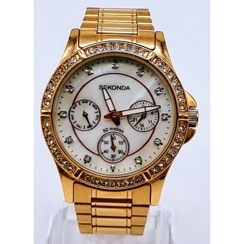 540 - A Sekonda Rose-Gold Plated Ladies Quartz Watch. Case - 35mm. White dial with three sub dials. White ... 