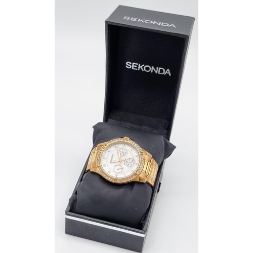 540 - A Sekonda Rose-Gold Plated Ladies Quartz Watch. Case - 35mm. White dial with three sub dials. White ... 